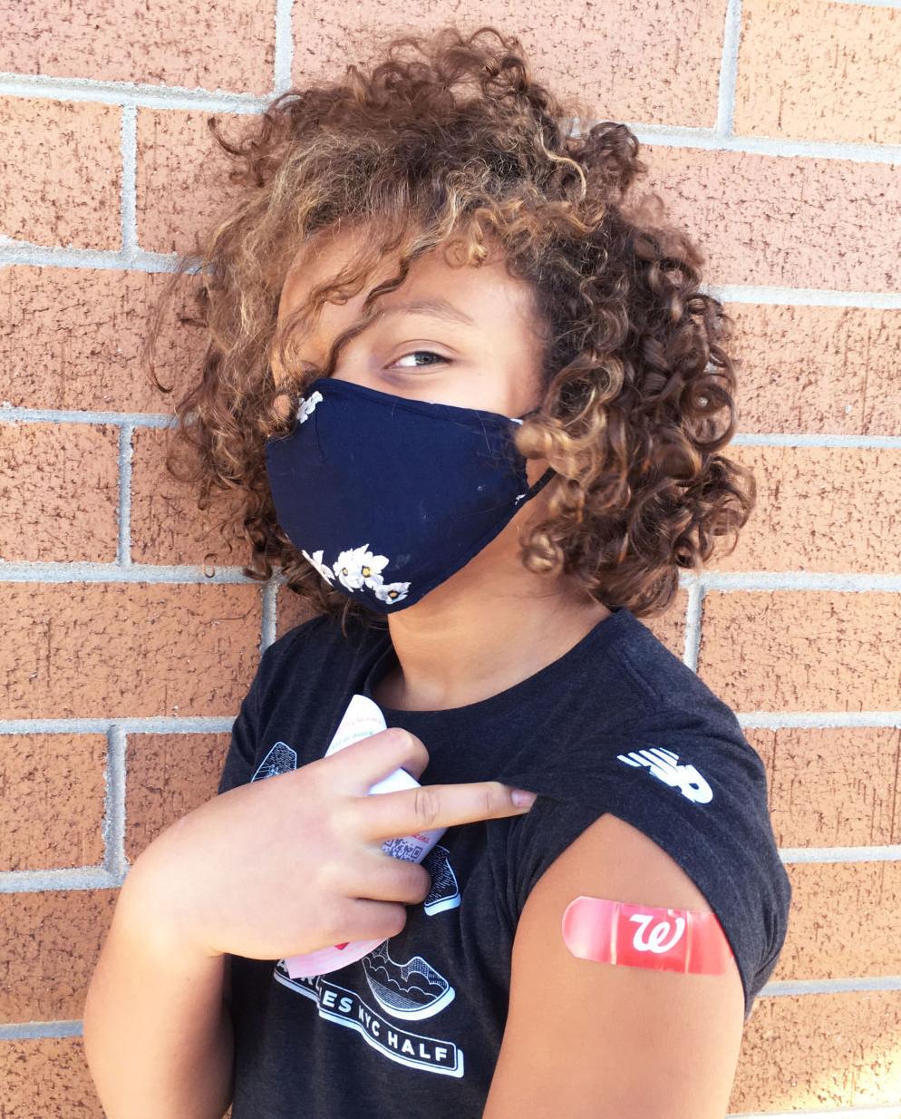 Finley Strauss-Thompkins, 10, of Racine gets COVID-19 vaccination